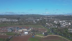 Paignton, Torbay, South Devon, England: DRONE VIEWS: A new build housing construction site on green belt land on the outskirts of Paignton. Paignton is a popular UK holiday resort (Clip 5).