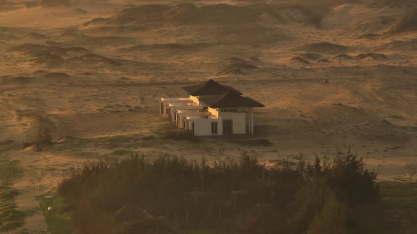 Sunset under the sea view villa, aerial view, sunrise and sand dunes