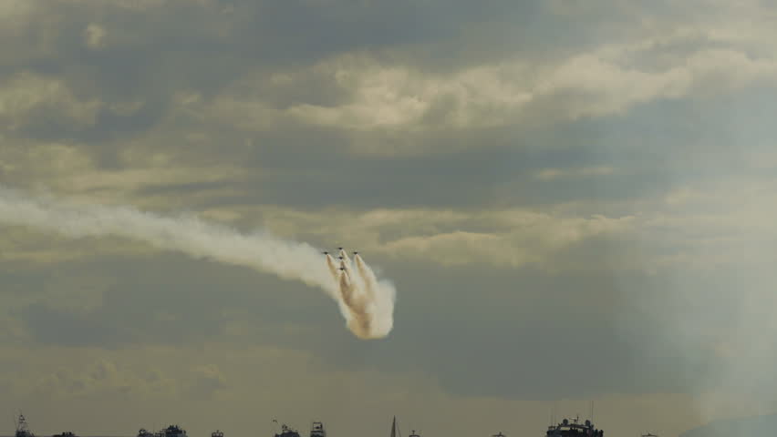 Fleet Of Fighter Planes Leaving Contrails Over Nautical Vessels Under Cloudy Sky - Huntington Beach, California