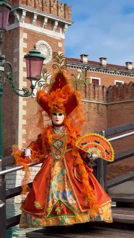 Venice Carnival. People in Venetian carnival masks and costumes on streets of Venice, Italy, Europe February 10, 2024 Vertical video. High quality 4k footage
