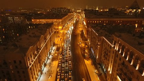 Cars Stuck in Traffic on Snowy Tverskaya Street at Night
