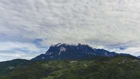 4K Time lapse of day view and dancing clouds over Mount Kinabalu in Sabah Borneo, Malaysia.