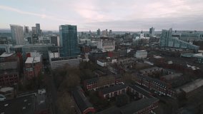 Establishing Aerial View Shot of Manchester UK, City Skyline England United Kingdom, day, patchy clouds, overcast