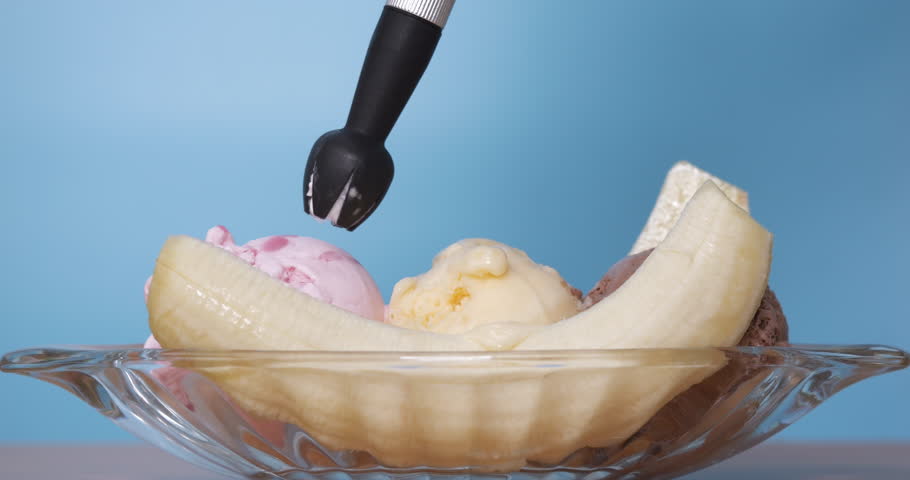 Squeeze whipped cream over the banana ice cream. Royalty-Free Stock Footage #3446733035