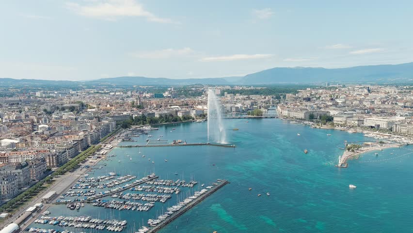Geneva, Switzerland. Fountain Je-Deau. Large fountain jet up to 140 meters. The main attraction of Lake Geneva. Summer day, Aerial View, Point of interest