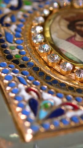 A closeup shot of a decorative red Bible with a gold cross in a church
