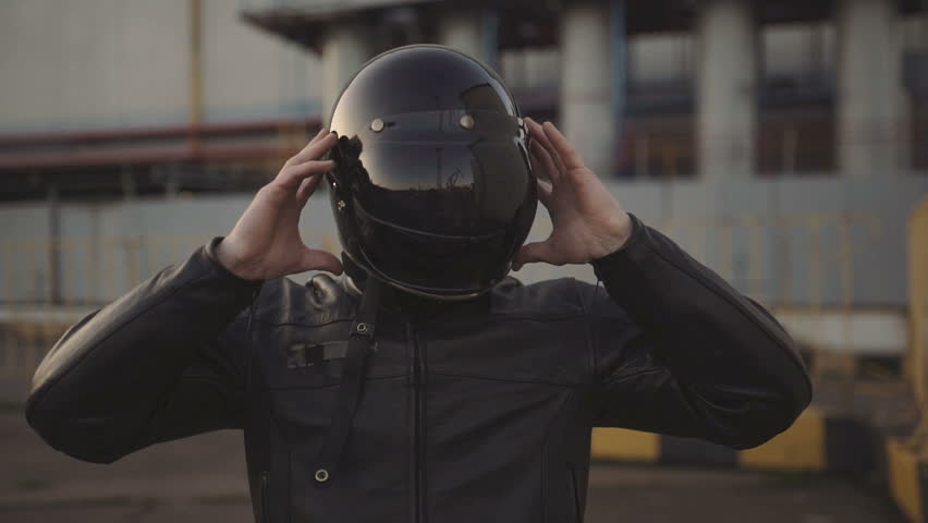 Young attractive man motorcyclist with his helmet and custom motorcycle on street  | Shutterstock HD Video #34470757