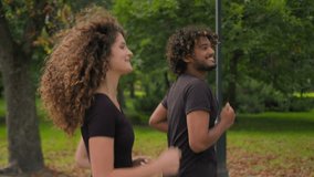 Indian man Caucasian woman multiracial couple friends girl guy happy sport people athletes running together in park outdoors morning run jog healthy workout jogging exercise active lifestyle in city - Powered by Shutterstock - Get 15% off with code: PIKWIZARD15