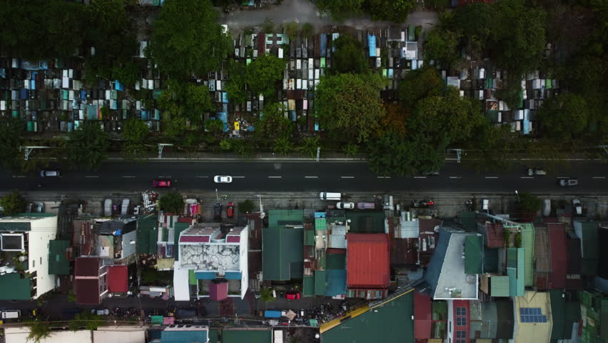 Cars on the South Avenue of Makati, Philippines - overhead, drone shot