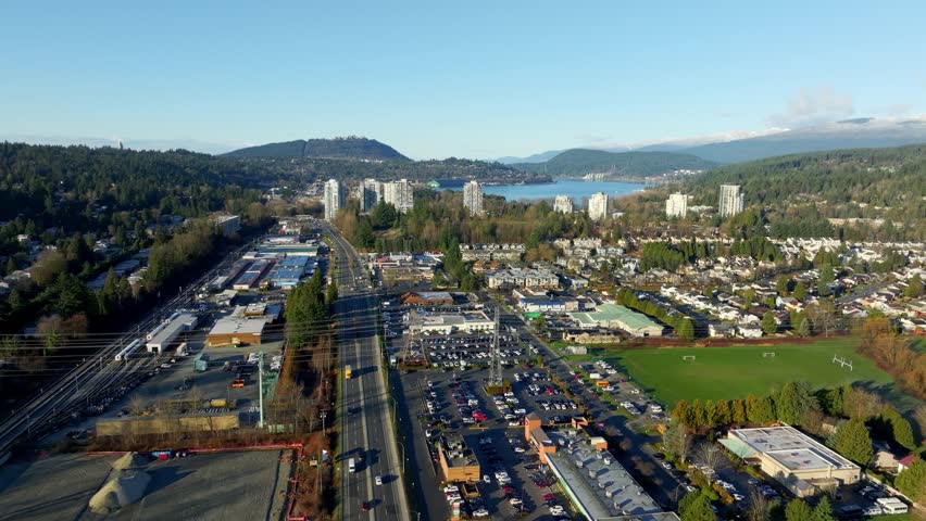 Barnet Road In The City Of Port Moody In British Columbia, Canada. Burrard Inlet In Distant View. aerial shot