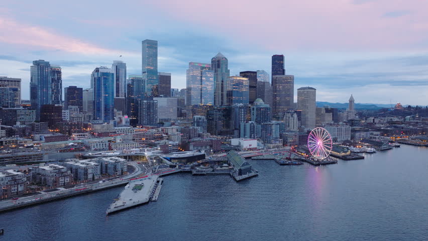 Financial and residential buildings cityscape view on overcast day 4K. Seattle Washington USA aerial drone footage of Waterfront park with Great Wheel. Downtown skyscrapers on cinematic background Royalty-Free Stock Footage #3447319587