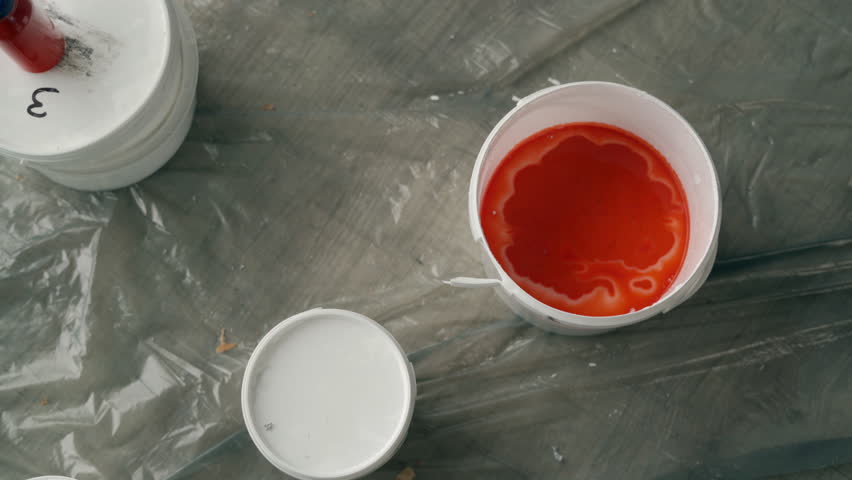 DIY tools and accessory. Paint is mixed in a bucket with a drill paddle mixer Royalty-Free Stock Footage #3447330619