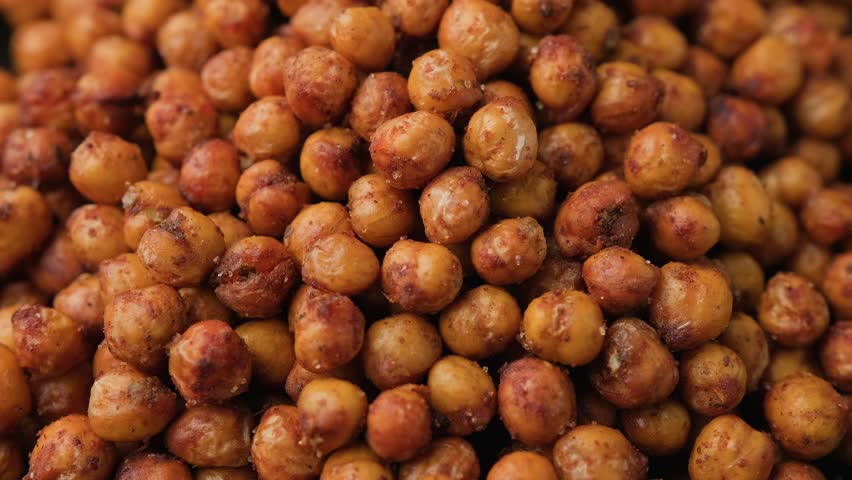 Healthy roasted chickpeas with herbs and spices. Rotating video.