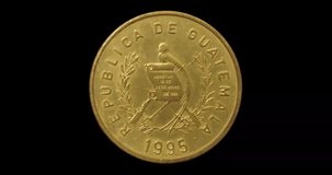 Obverse of Guatemala coin 1 centavo 1995, isolated in black background. Seamless animation in 4k resolution video.
