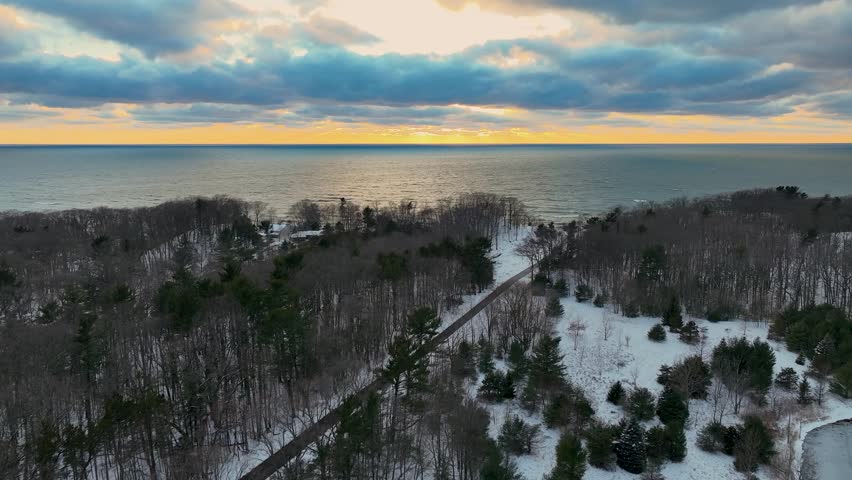 Slowly pushing toward the sun at dusk over Lake Michigan.