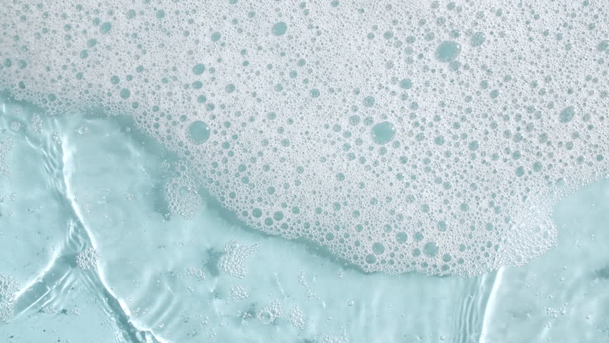 Bubbles of white soap foam on a blue background. Bathtup Soap Foam. Texture of Soap Foam Bubbles. Natural White Shampoo Bubbles Motion Royalty-Free Stock Footage #3447432945
