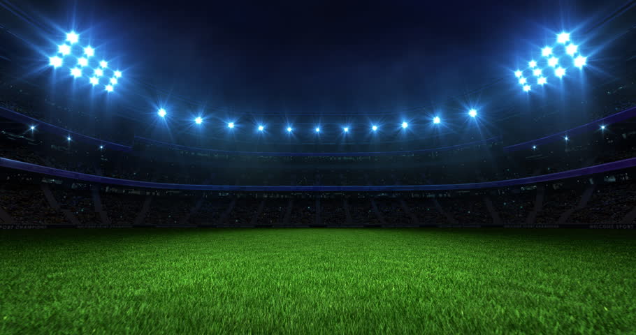 Sports background with a stadium at night with glowing spotlights. Camera flying over grass field. Professional 4K video loop for sports advertisement. Royalty-Free Stock Footage #3447451967