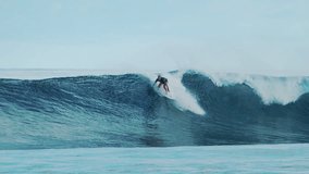 Surfer rides the big ocean wave in the Maldives - Powered by Shutterstock - Get 15% off with code: PIKWIZARD15