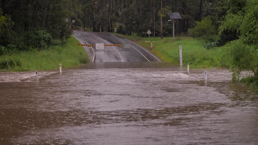 Gold Coast, Queensland, 16 February 2024 - Medium shot of flooding across Hardy