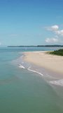 Aerial video of beauty deserted beach cape and calm sea in Thailand. Vertical video