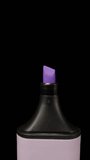 Violet marker on a black background, magnification. Dolly slider extreme close-up. Laowa Probe Vertical video.