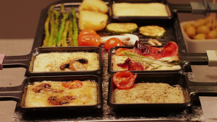 French Swiss or Spanish restaurant with traditional tapas food, Spanish cuisine, delicious tapas and cheese plate, bruschetta with cheese, olives dry tomatoes and tasty sandwich bar appetizer, buffet