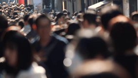 Unfocused blurry crowd of people walking in the street. Slow motion. - Powered by Shutterstock - Get 15% off with code: PIKWIZARD15
