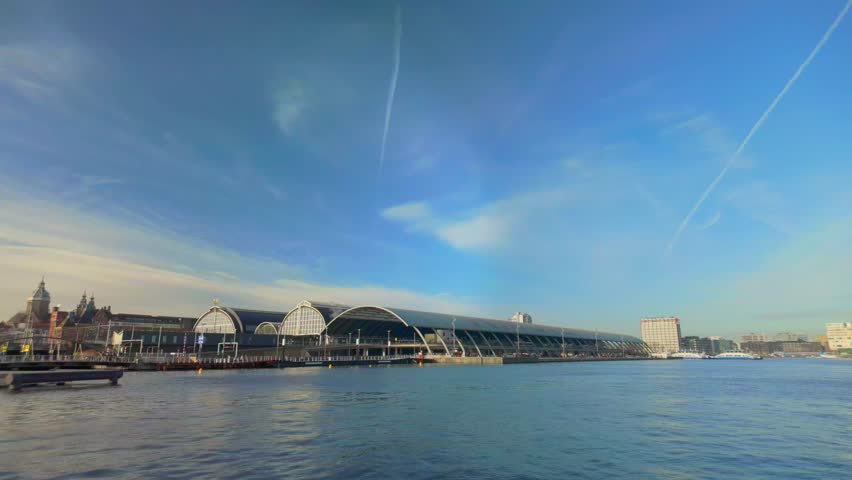 Approaching Amsterdam Central Station on IJ river
