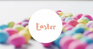 Animation of easter text over colourful easter eggs on white background. Easter, religion, christianity, tradition and celebration concept digitally generated video.