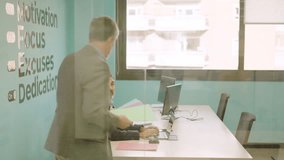 Man delivering files to employees in a coworking space