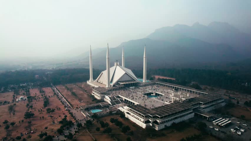 Faisal mosque in islamabad, tranquil morning with soft light, mountains in backdrop, aerial view Royalty-Free Stock Footage #3447761737