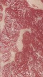 rotating steak macro video. View from above Vertical video.