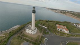 Drone flying around Biarritz Lighthouse, France. Aerial FPV