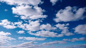 Timelapse of cumulus clouds moves in the blue sky. The background of light and heavy calm clouds changes shape in cloudy space. Natural background, time-lapse, copy space. 4K. - Powered by Shutterstock - Get 15% off with code: PIKWIZARD15