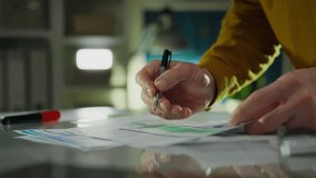 In a work environment, male analyst dressed in a stylish uniform is intently conducting a data audit in a meeting room. Smooth camera movement captures a senior manager carefully analyzing information - Powered by Shutterstock - Get 15% off with code: PIKWIZARD15