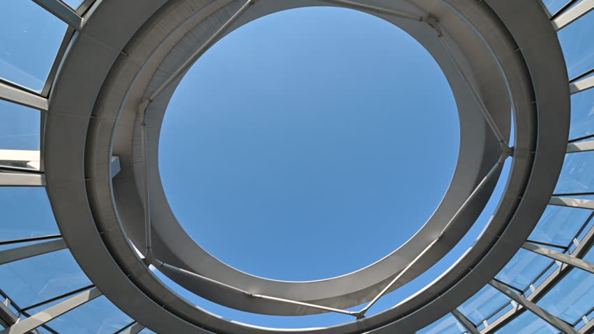 Berlin,Germany,August 15, 2023. Fascinating footage with rotational movement from inside the glass and metal dome located on the roof of the Reichstag building. In the center it is open. Sunny day.