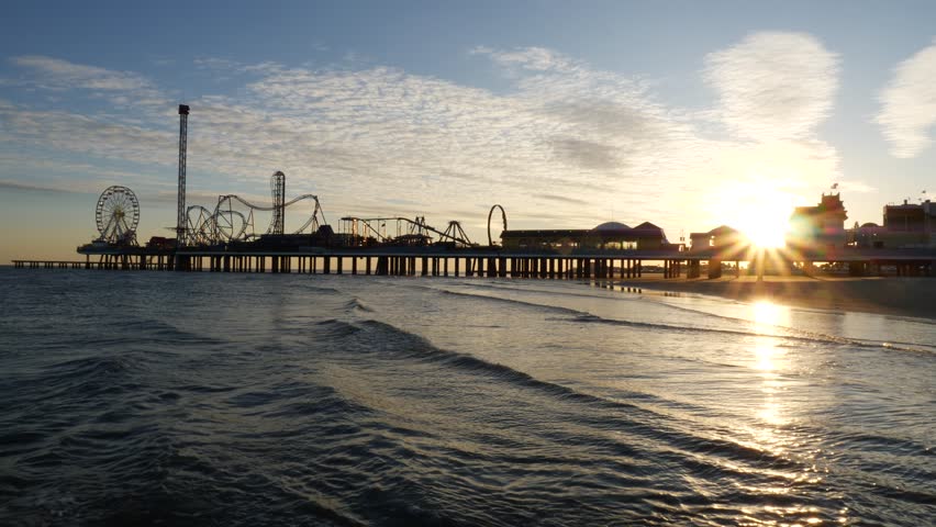 Sunset Behind the Galveston Pier Silhouette Beach Ocean Blue Wave