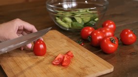 A vegan woman skillfully slices fresh tomatoes showing the essence of vegan cooking The vibrant red of tomatoes contrasts with color of cutting board, accentuating natural beauty of vegan ingredients - Powered by Shutterstock - Get 15% off with code: PIKWIZARD15