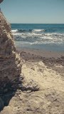 Vertical video of beach landscape, summer waves, paradise travel. South of Spain.