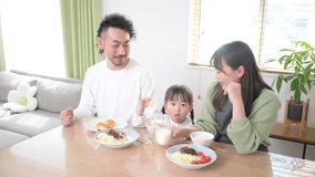 Video of an image of a happy Japanese family eating lunch or breakfast in the dining room