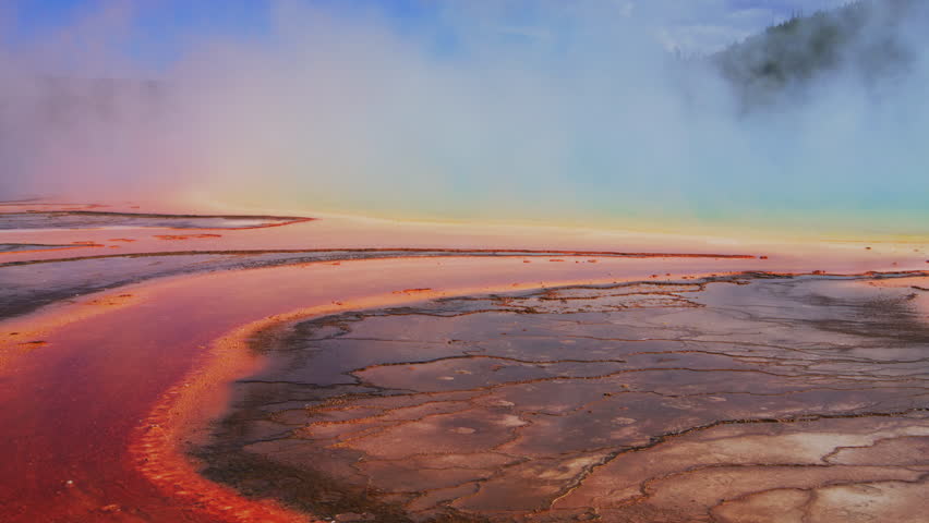 Amazing natural rainbow landscape, colorful geothermal pools of Yellowstone, creating a breathtaking landscape of warm hues and steam. Yellowstone National Park, Wyoming, USA, Slow Motion, 4K RAW.  Royalty-Free Stock Footage #3448473927
