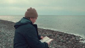 Senior Man Reading Book by Stony Beach - Powered by Shutterstock - Get 15% off with code: PIKWIZARD15