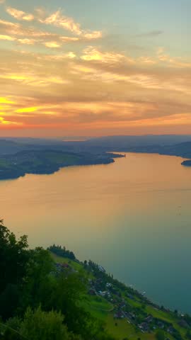 Panoramic View over Mountain and Lake Lucerne and City of Lucerne in a Sunset in Lucerne, Switzerland. Royalty-Free Stock Footage #3448488943