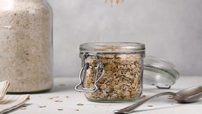 Oatmeal oats flakes in a jar. Breakfast porridge  - Powered by Shutterstock - Get 15% off with code: PIKWIZARD15
