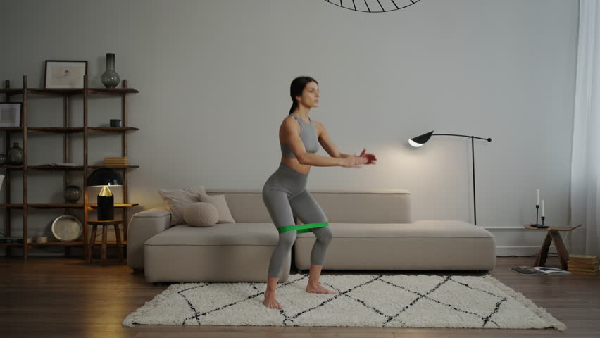 Beautiful Young Woman Doing Sport In Living Room, Home Fitness For Stay Healthy And Slender Royalty-Free Stock Footage #3448626867
