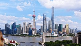 Aerial video of modern city buildings scenery in Shanghai. Famous city landmarks in China. Drone shooting forward.