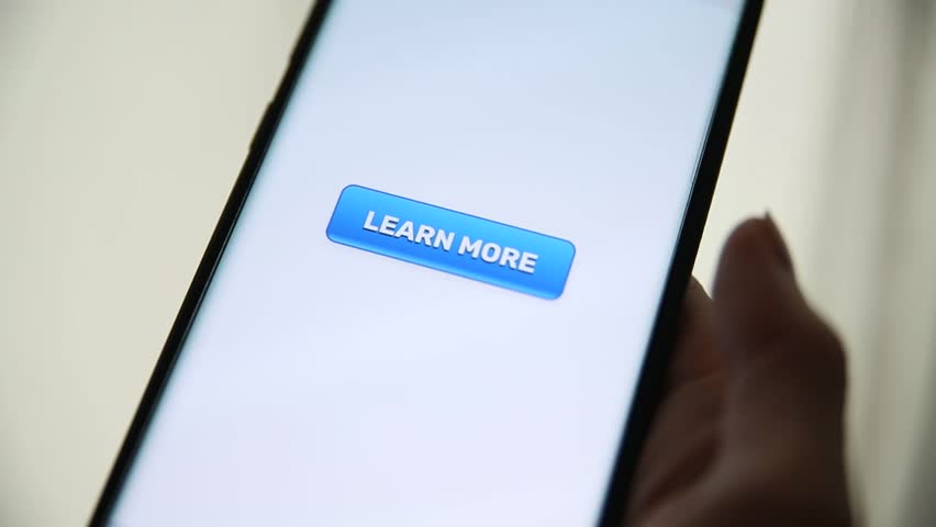 Woman clicks blue Learn More Button Button on her mobile phone.