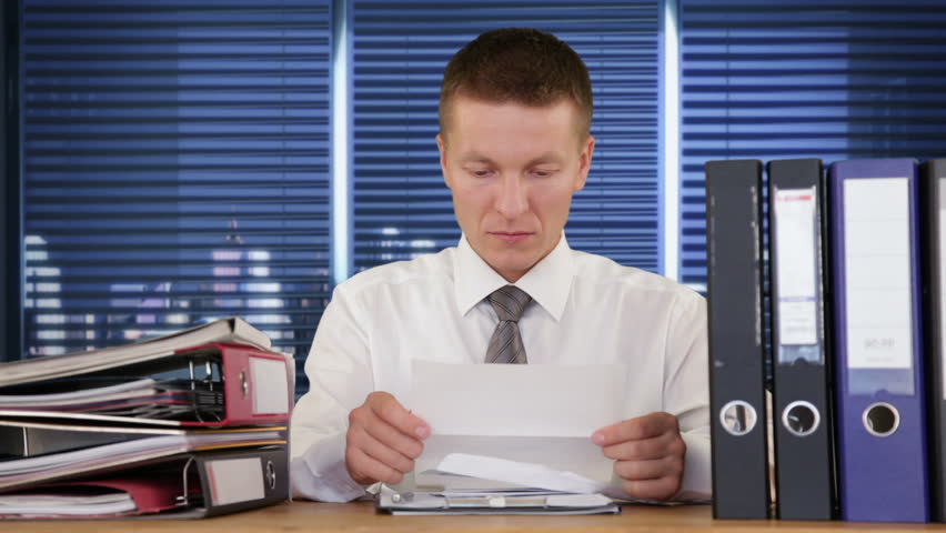 Young Businessman getting fired through a letter