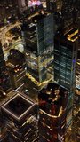 Dazzling panorama of marvelous New York at night. Drone footage over the vibrant city full of light. Vertical video.