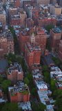 Daytime panorama of remarkable New York. Drone footage over the diverse buildings of metropolis. Aerial view. Vertical video.